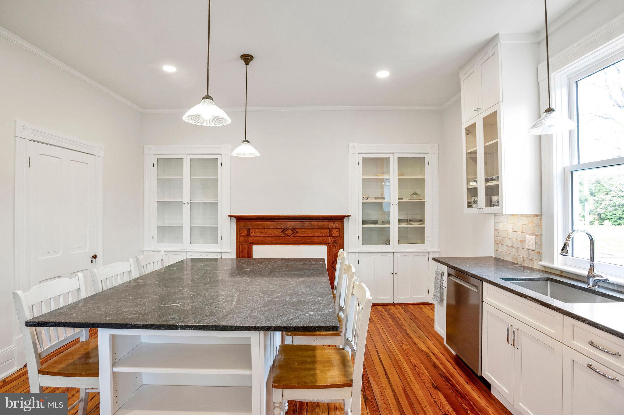 558 Gay Street Washington, VA 22747 - Photo 19 of 52 a kitchen with stainless steel appliances granite countertop a sink and a counter space