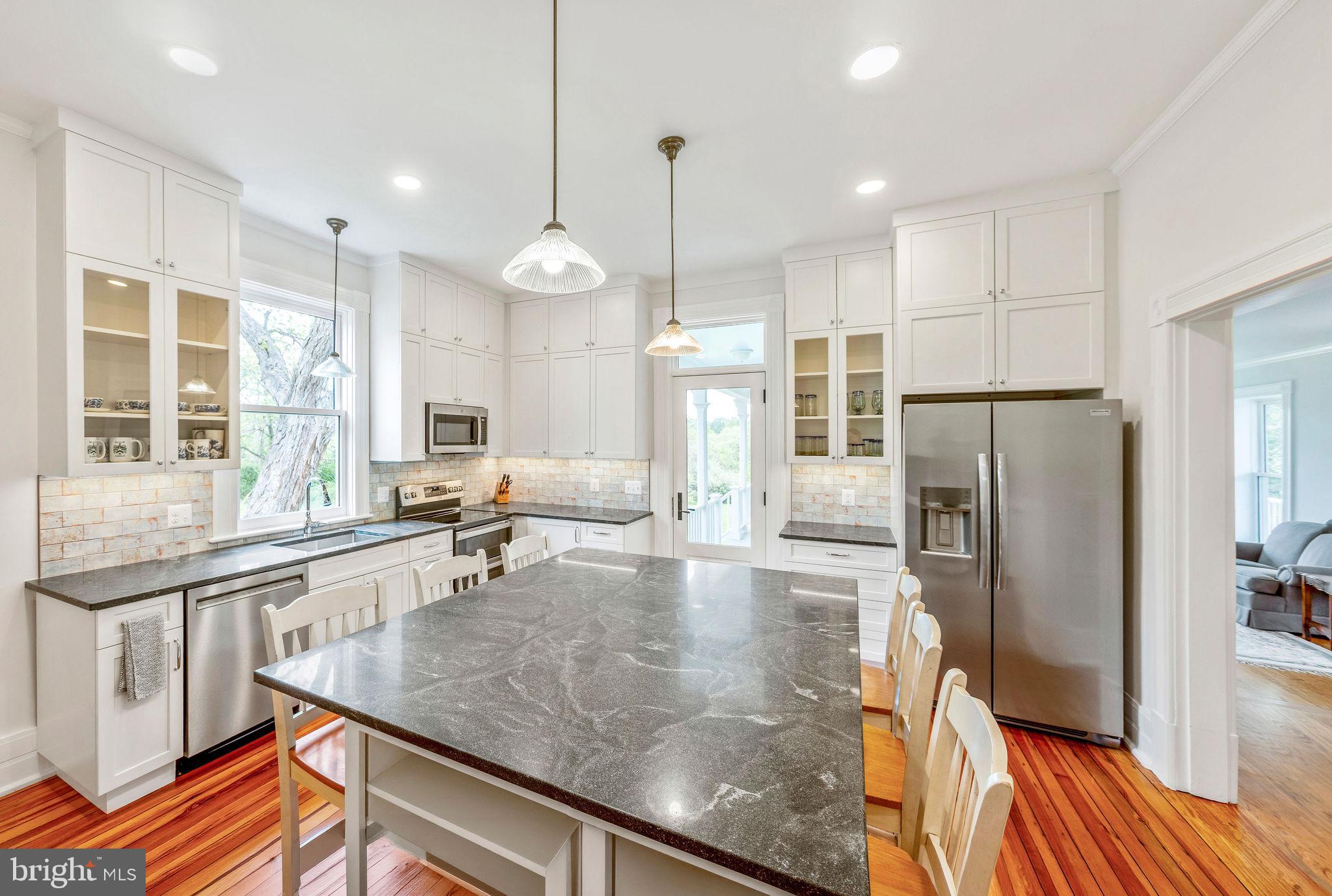 558 Gay Street Washington, VA 22747 - Photo 21 of 52 a kitchen with stainless steel appliances granite countertop a refrigerator a sink and a stove