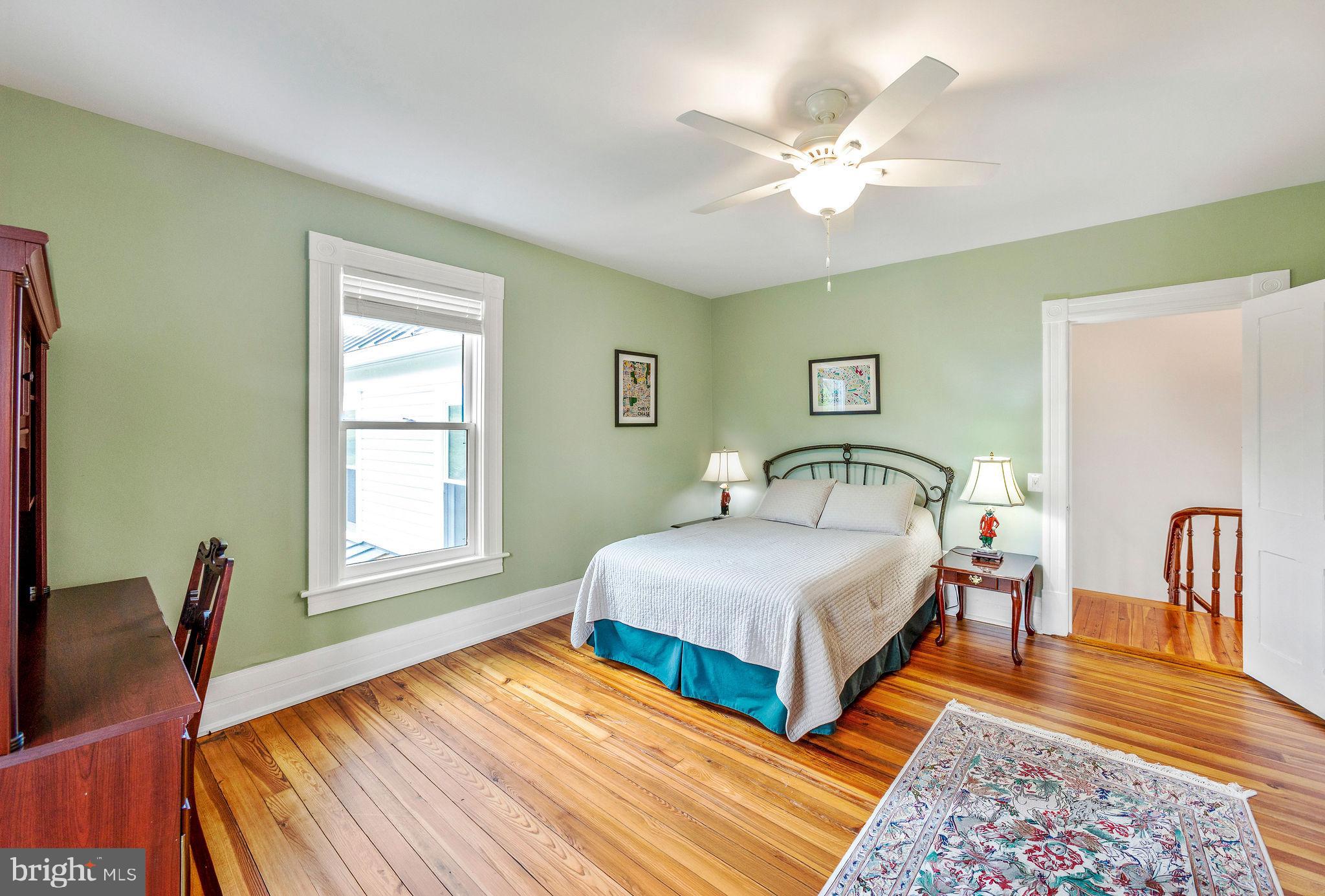 558 Gay Street Washington, VA 22747 - Photo 31 of 52 a spacious bedroom with a bed and window