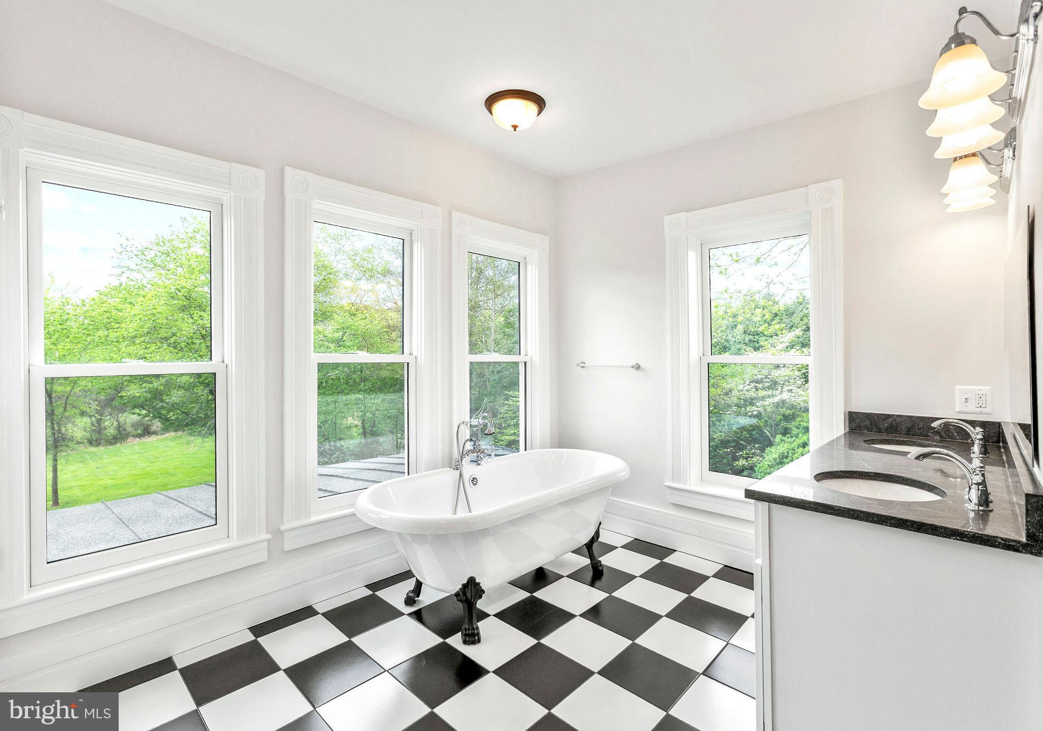 558 Gay Street Washington, VA 22747 - Photo 34 of 52 a room with a black white checkered floor with a gaming machine and a sink
