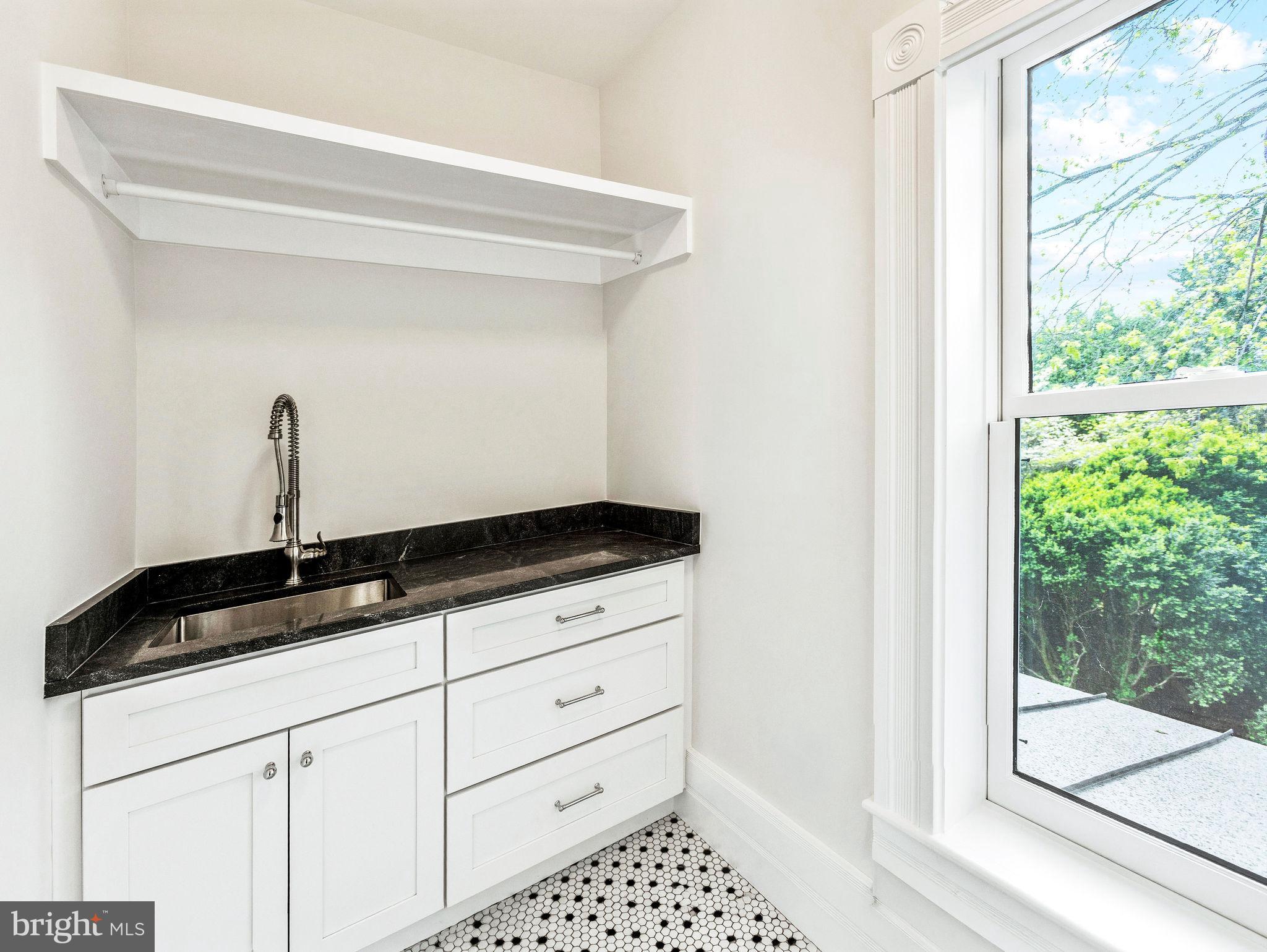 558 Gay Street Washington, VA 22747 - Photo 37 of 52 a close view of a sink a mirror and a window