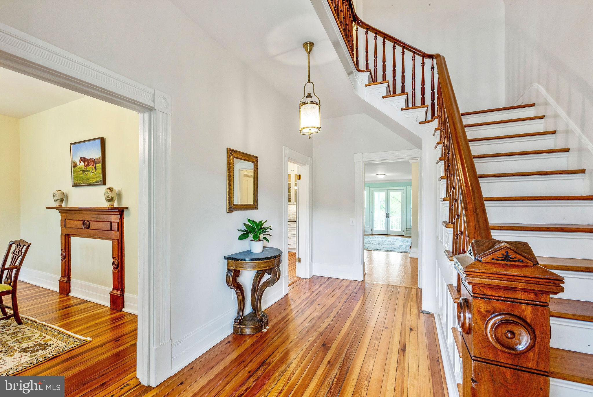 558 Gay Street Washington, VA 22747 - Photo 6 of 52 a view of a livingroom with furniture a dinning room wooden floor and windows