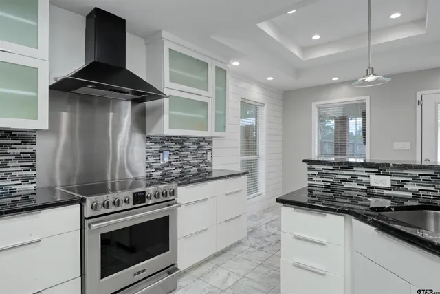 a kitchen with a stove and a sink