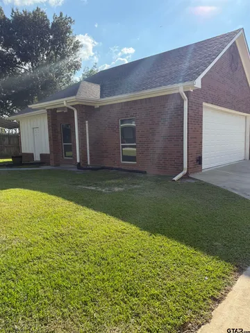 a view of a backyard with a garden