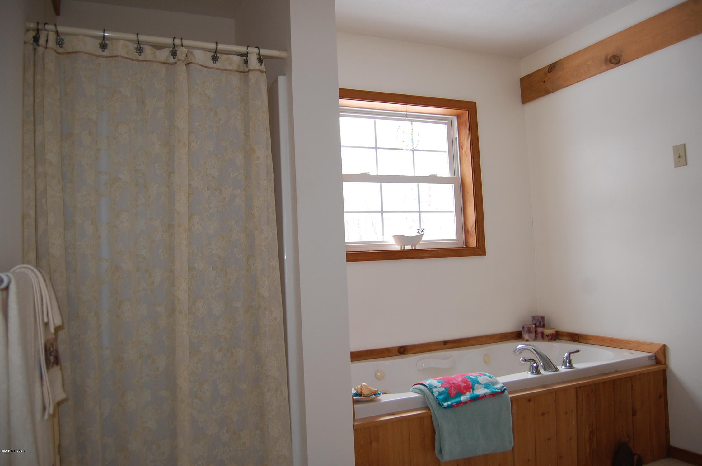 215 Maple Ridge Drive Hawley, PA 18428 - Photo 11 of 14 a room with a window and tub