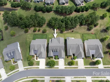 a view of a swimming pool and a yard