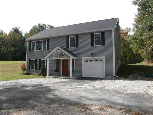 57 A Mason Road Dudley, MA 01571 - Photo 1 of 1 a front view of a house with a yard
