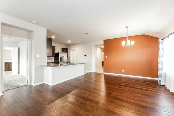 a view of kitchen with wooden floor