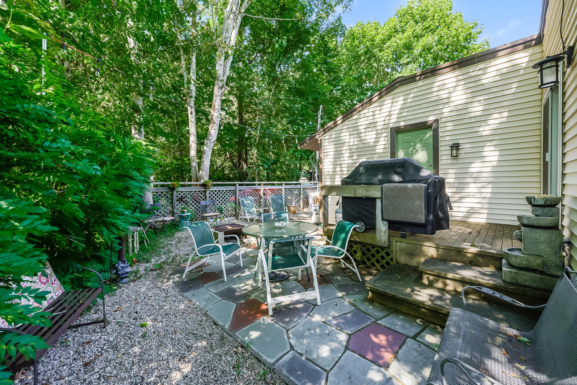 54 Pine Tree Drive Centerville, MA 02632 - Photo 14 of 16 a view of backyard with outdoor seating a patio and plants