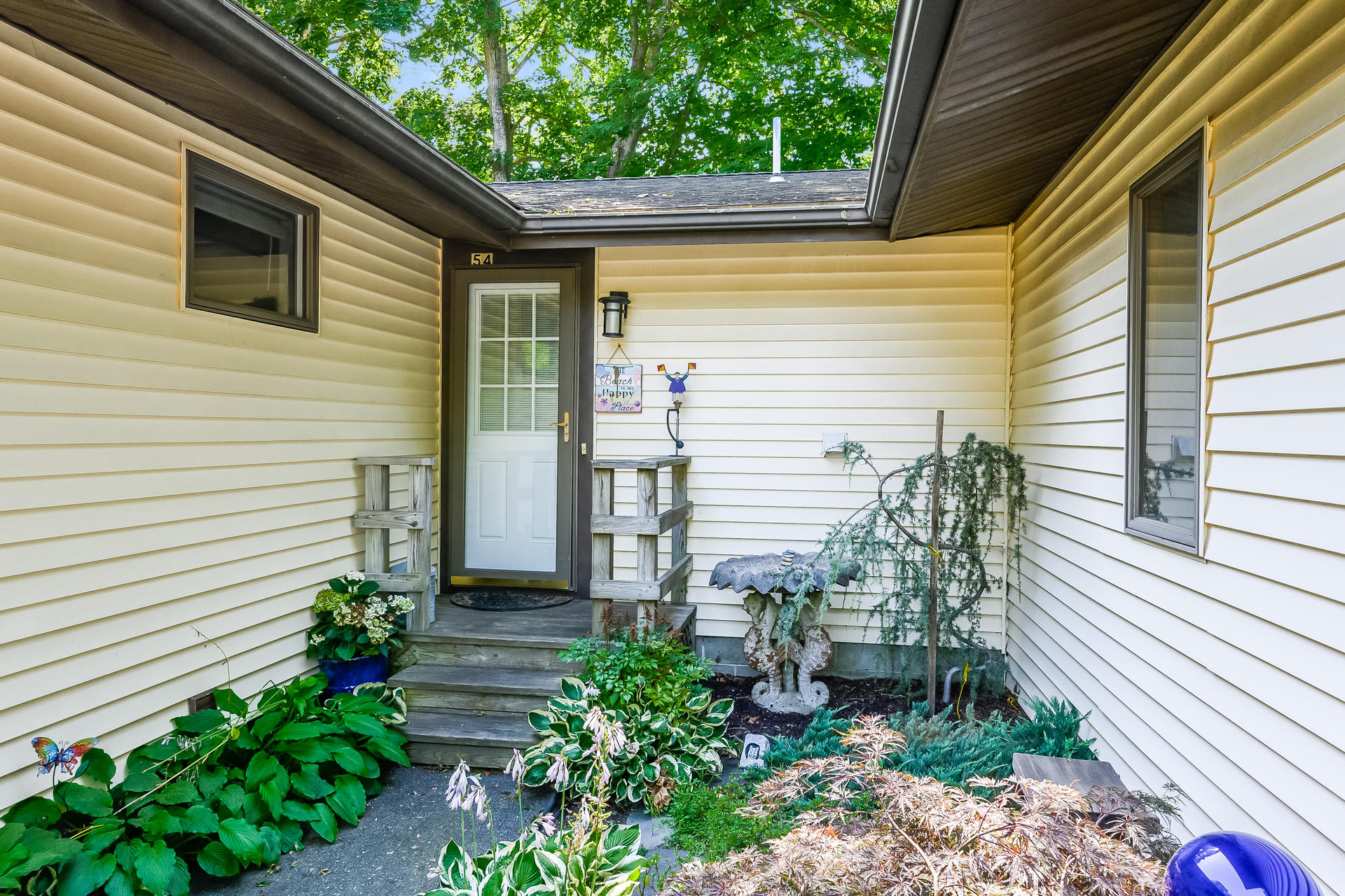 54 Pine Tree Drive Centerville, MA 02632 - Photo 16 of 16 a front view of a house with garden