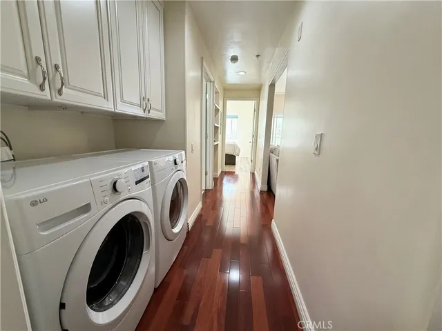 a view of hallway with washer and dryer