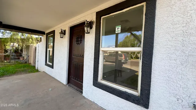 a view of a hallway with a glass door and porch