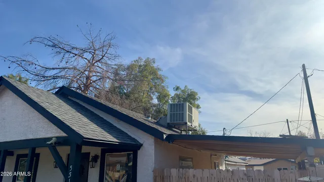 a roof deck with the plants and wooden fence