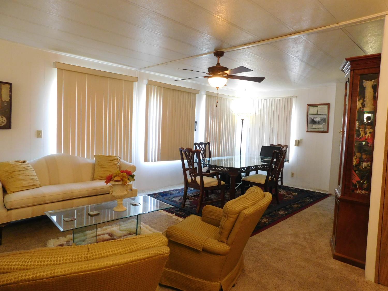 43 Rio Vista Drive Lodi, CA 95240 - Photo 12 of 27 a living room with furniture a ceiling fan and a window
