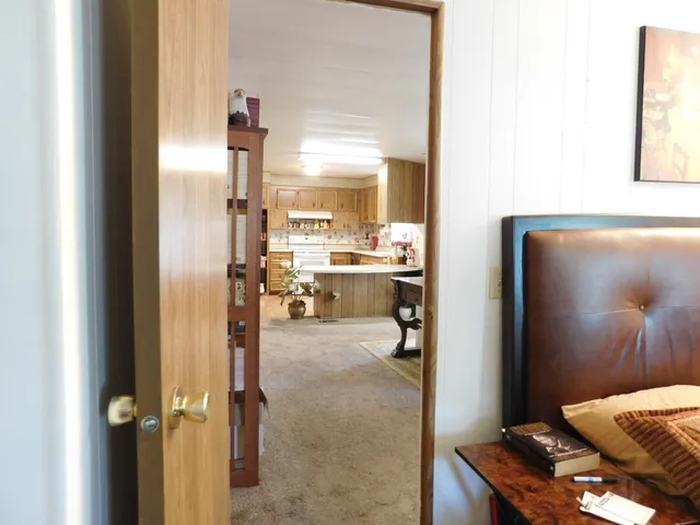 a view of a bathroom with a tub and mirror