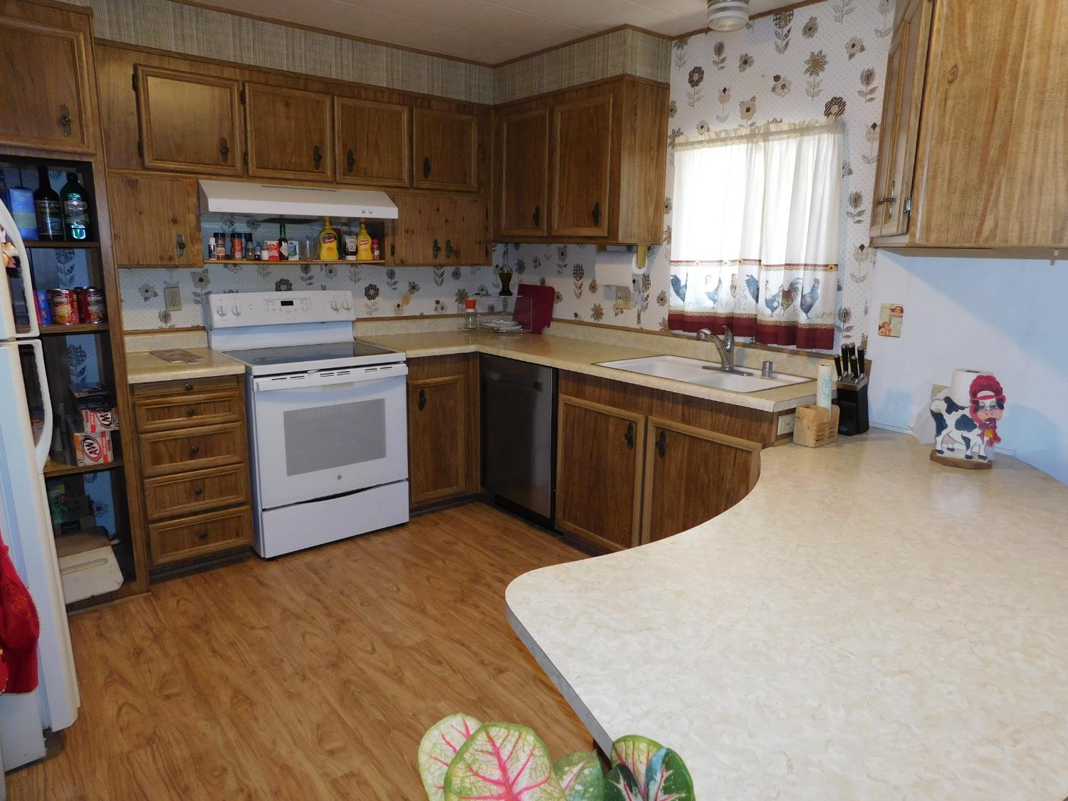 43 Rio Vista Drive Lodi, CA 95240 - Photo 8 of 27 a kitchen with stainless steel appliances a stove a sink and a refrigerator