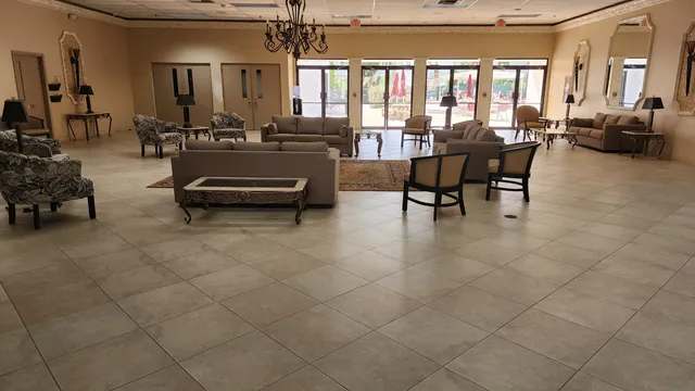 a living room with furniture and a large window