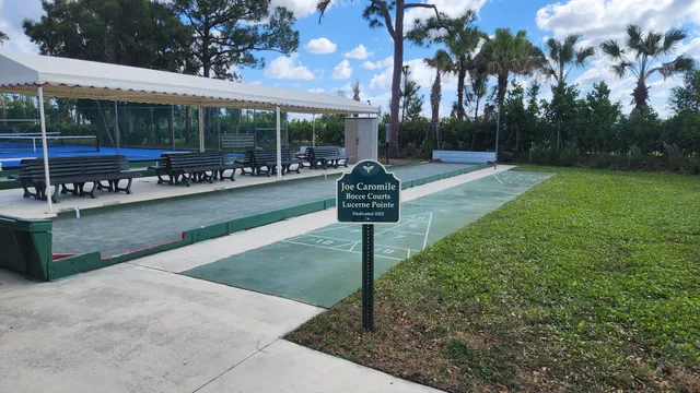 a swimming pool view with a garden space