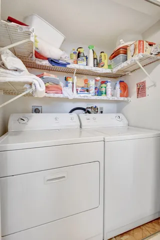 a utility room with dryer and washer