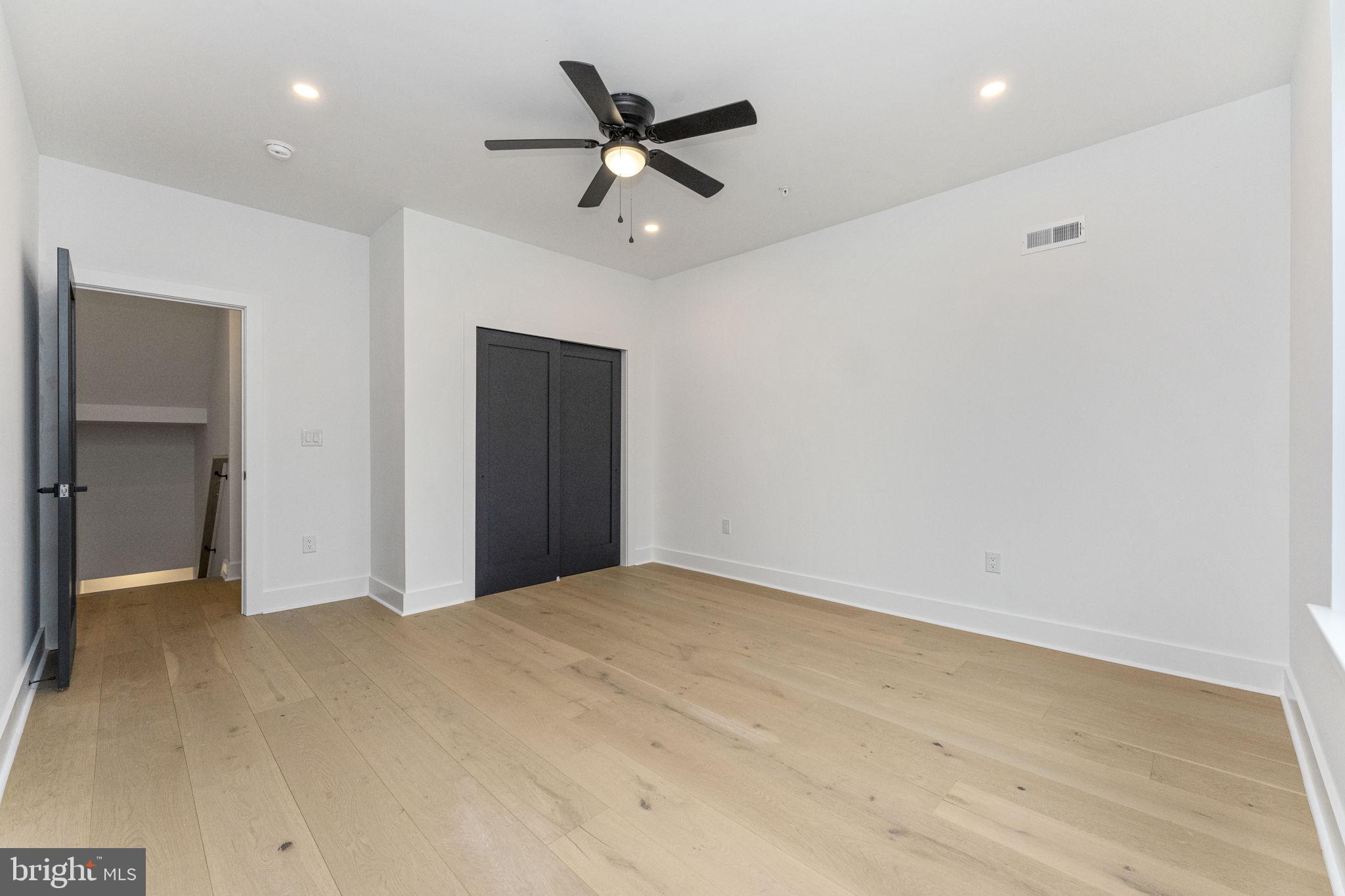 4475 Fleming Street Philadelphia, PA 19128 - Photo 12 of 24 a view of a livingroom with a ceiling fan & wooden floor
