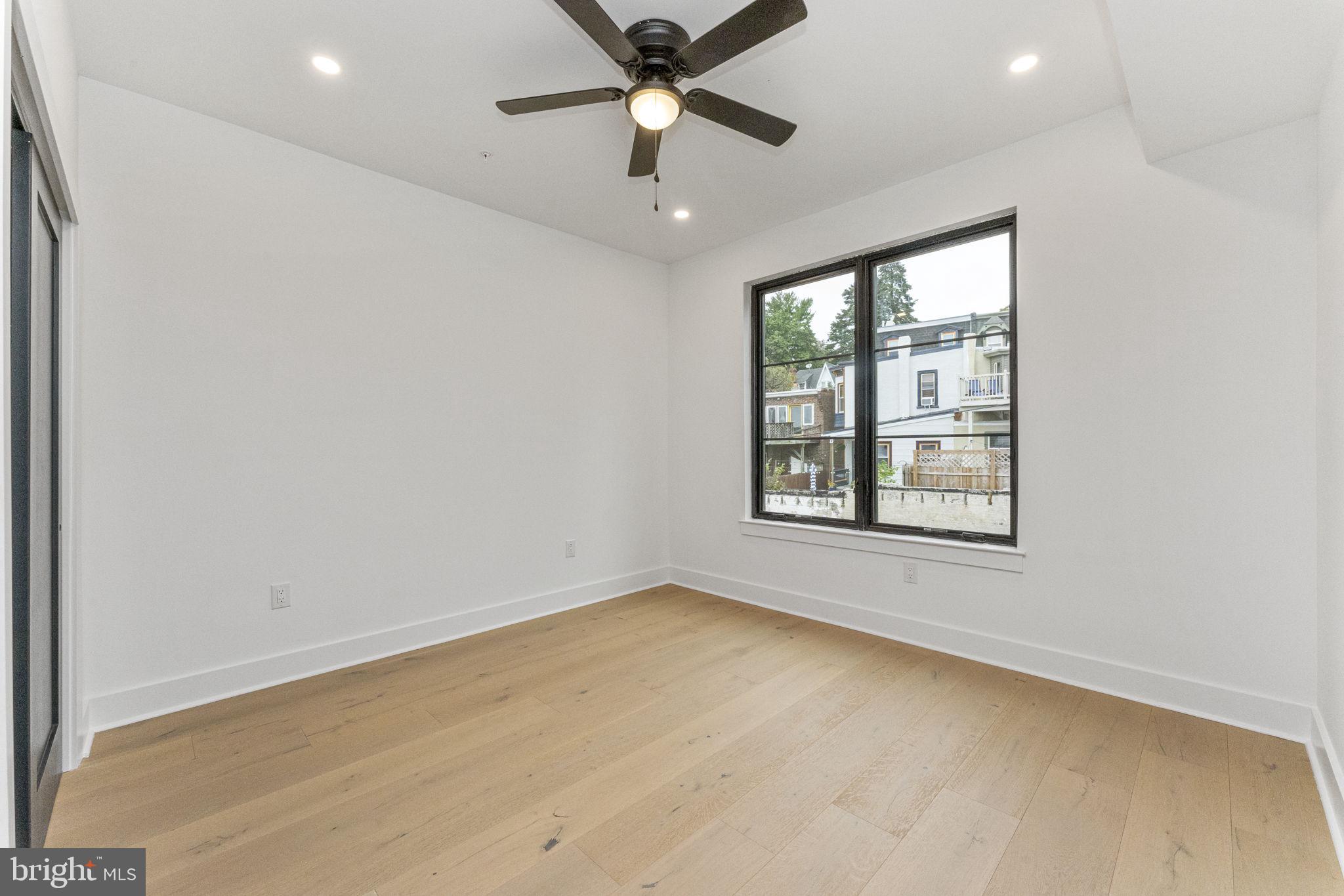 4475 Fleming Street Philadelphia, PA 19128 - Photo 15 of 24 an empty room with a window and a ceiling fan
