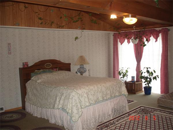 307 Stafford Road Monson, MA 01057 - Photo 8 of 9 a bedroom with a bed and window