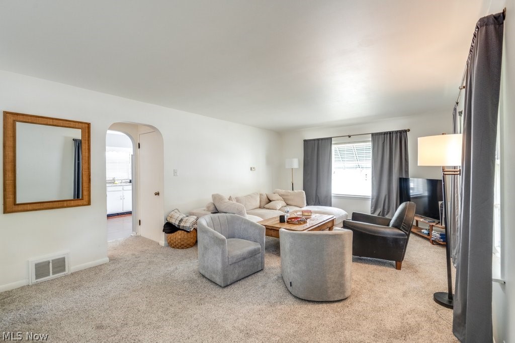 3569 Elm Road Stow, OH 44224 - Photo 6 of 17 Bright living area featuring light-colored carpeting and white walls