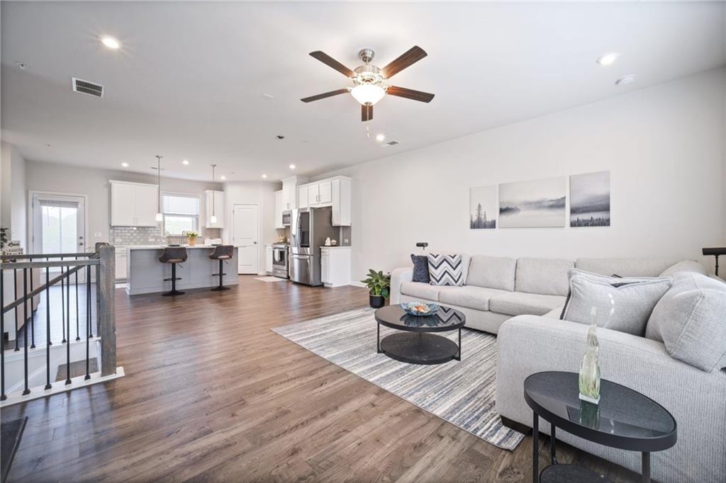1595 Ridgebrook Downs Mableton, GA 30126 - Photo 6 of 39 a living room with furniture and kitchen view