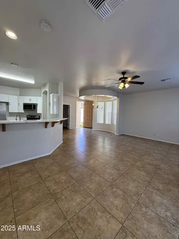 a view of a kitchen with furniture and chandelier