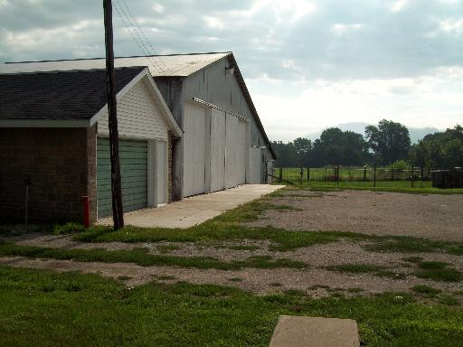 1320 East 16th Road Streator, IL 61364 - Photo 15 of 16 a view of backyard of house and car parked