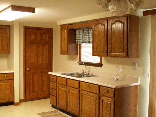 1320 East 16th Road Streator, IL 61364 - Photo 4 of 16 a bathroom with a double vanity sink and a mirror