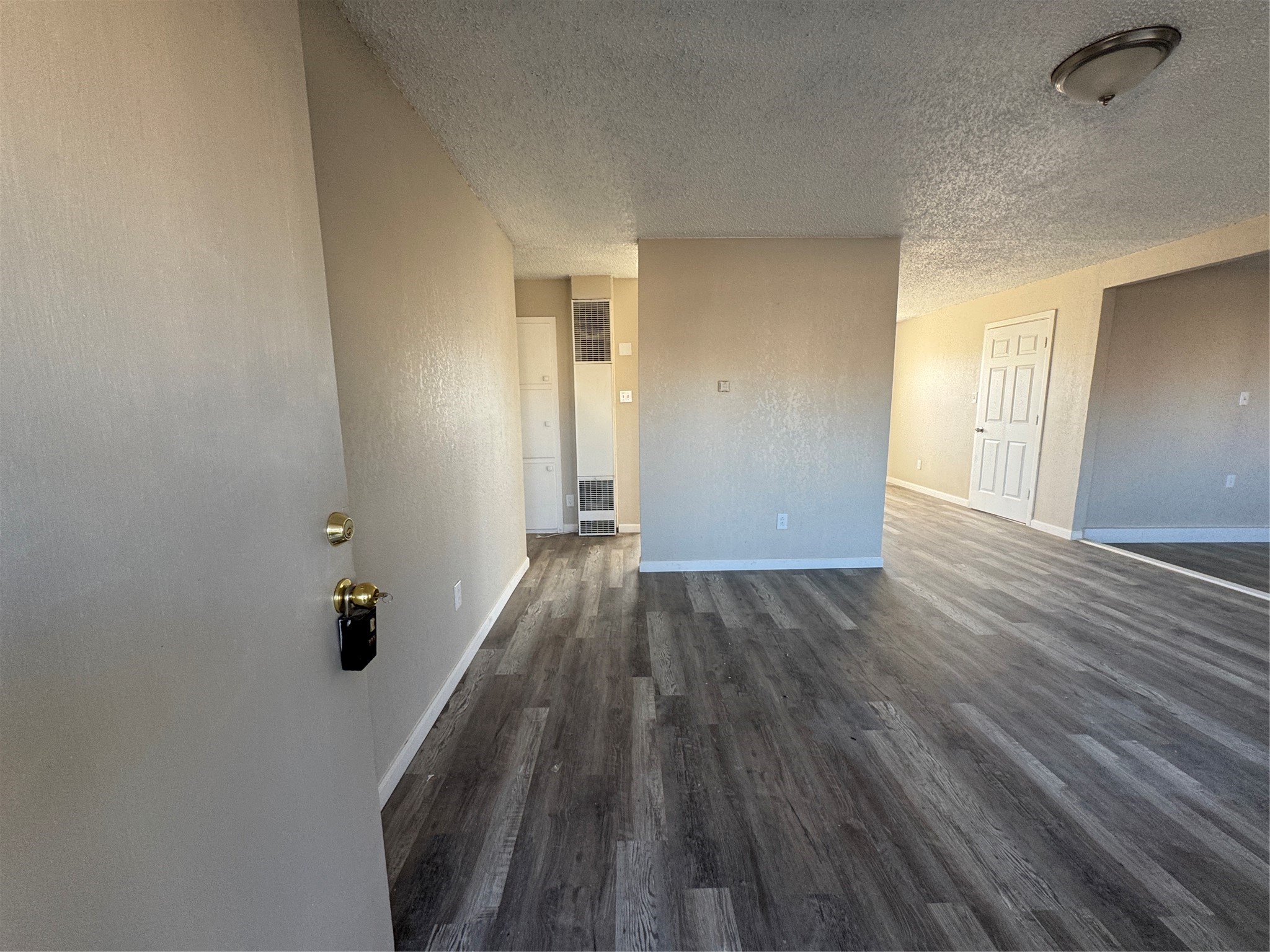 2704 East Colgate Street Lubbock, TX 79403 - Photo 2 of 11 a view of a hallway with wooden floor