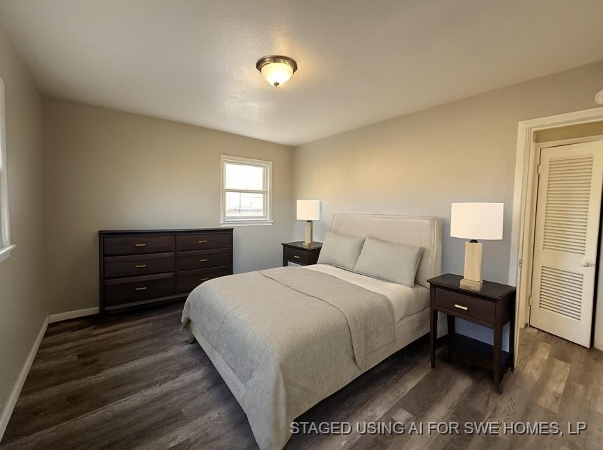 2704 East Colgate Street Lubbock, TX 79403 - Photo 8 of 11 a bedroom with a bed and a dresser
