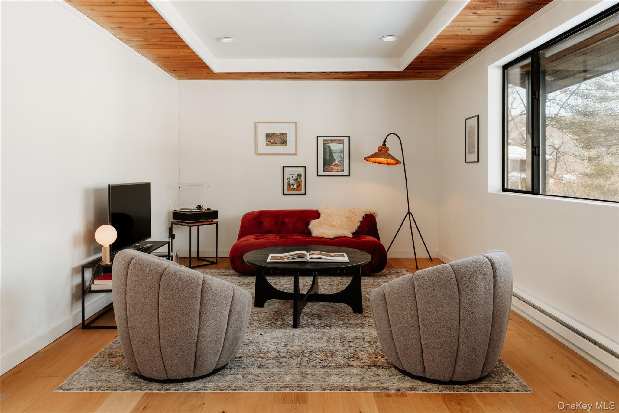 33 4th Street Narrowsburg, NY 12764 - Photo 4 of 26 a living room with furniture a window and a flat screen tv