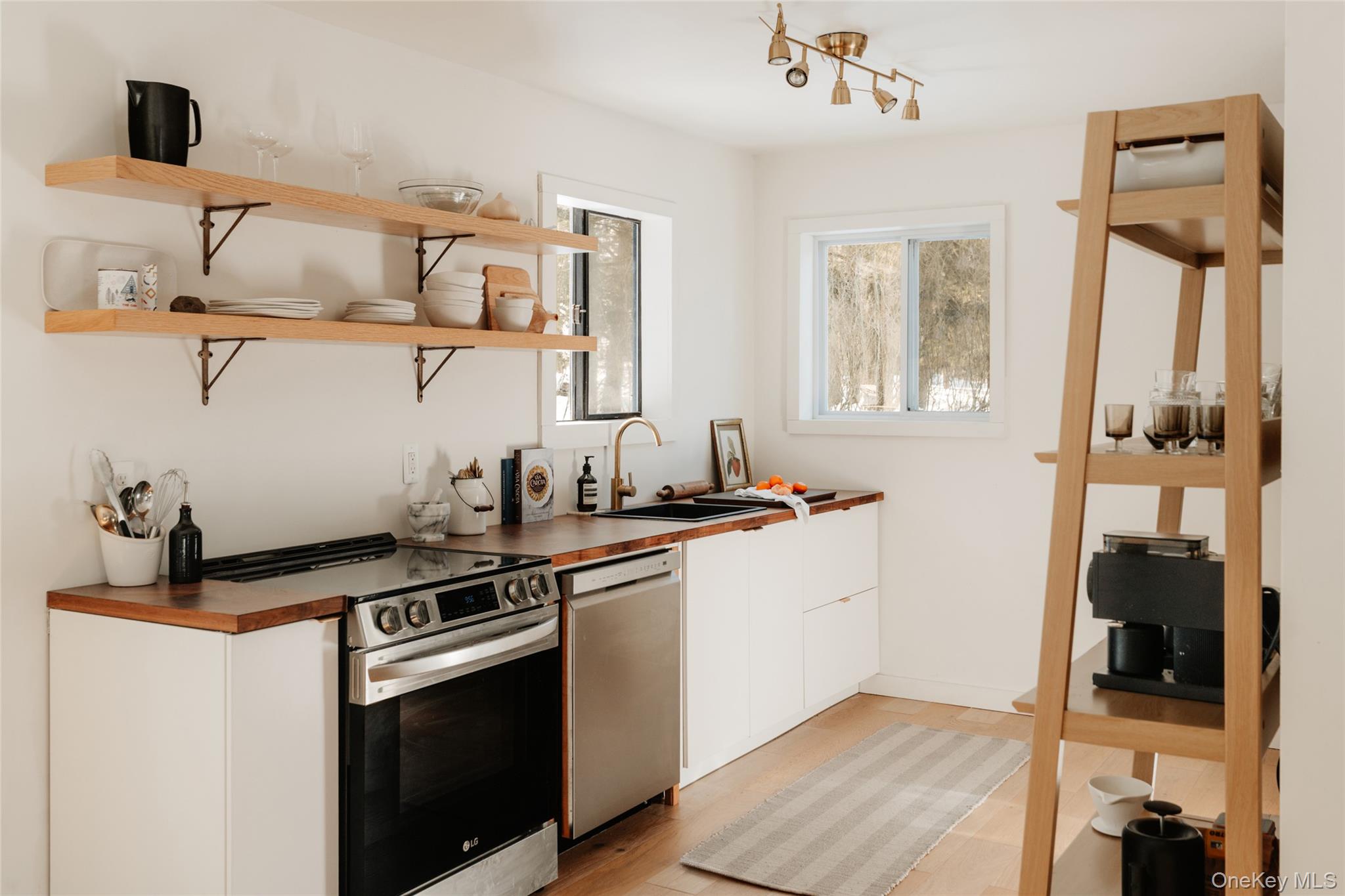33 4th Street Narrowsburg, NY 12764 - Photo 9 of 26 a kitchen with stainless steel appliances granite countertop a stove and a sink