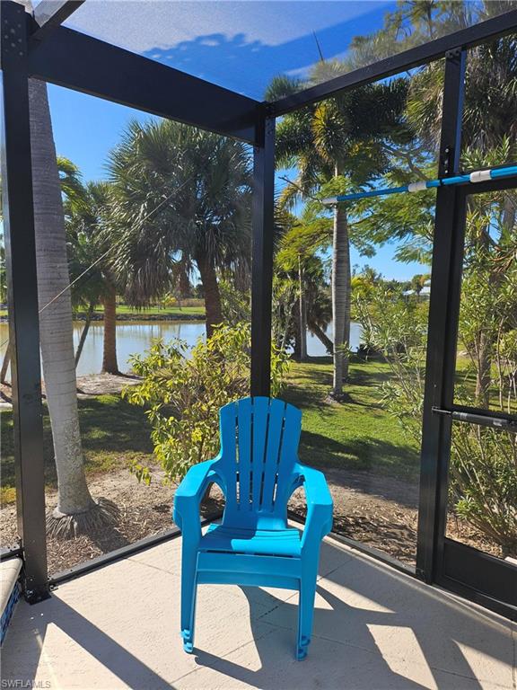 7791 Grande Pine Road Bokeelia, FL 33922 - Photo 11 of 45 a wooden bench sitting in front of a building
