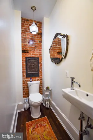 a large kitchen with kitchen island granite countertop a large window and stainless steel appliances