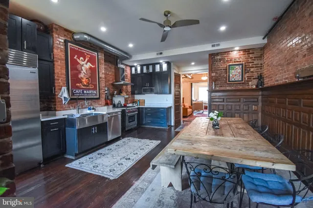 a view of a brick house with many windows