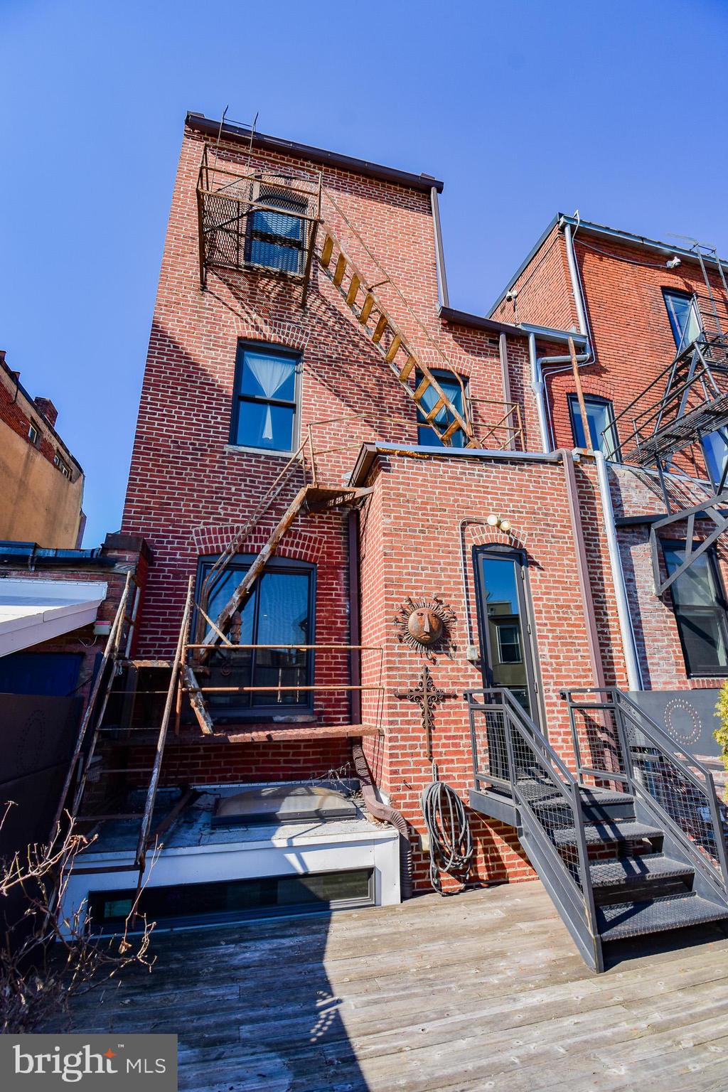 1830 Columbia Road Northwest Washington, DC 20009 - Photo 17 of 46 a view of a brick house with many windows