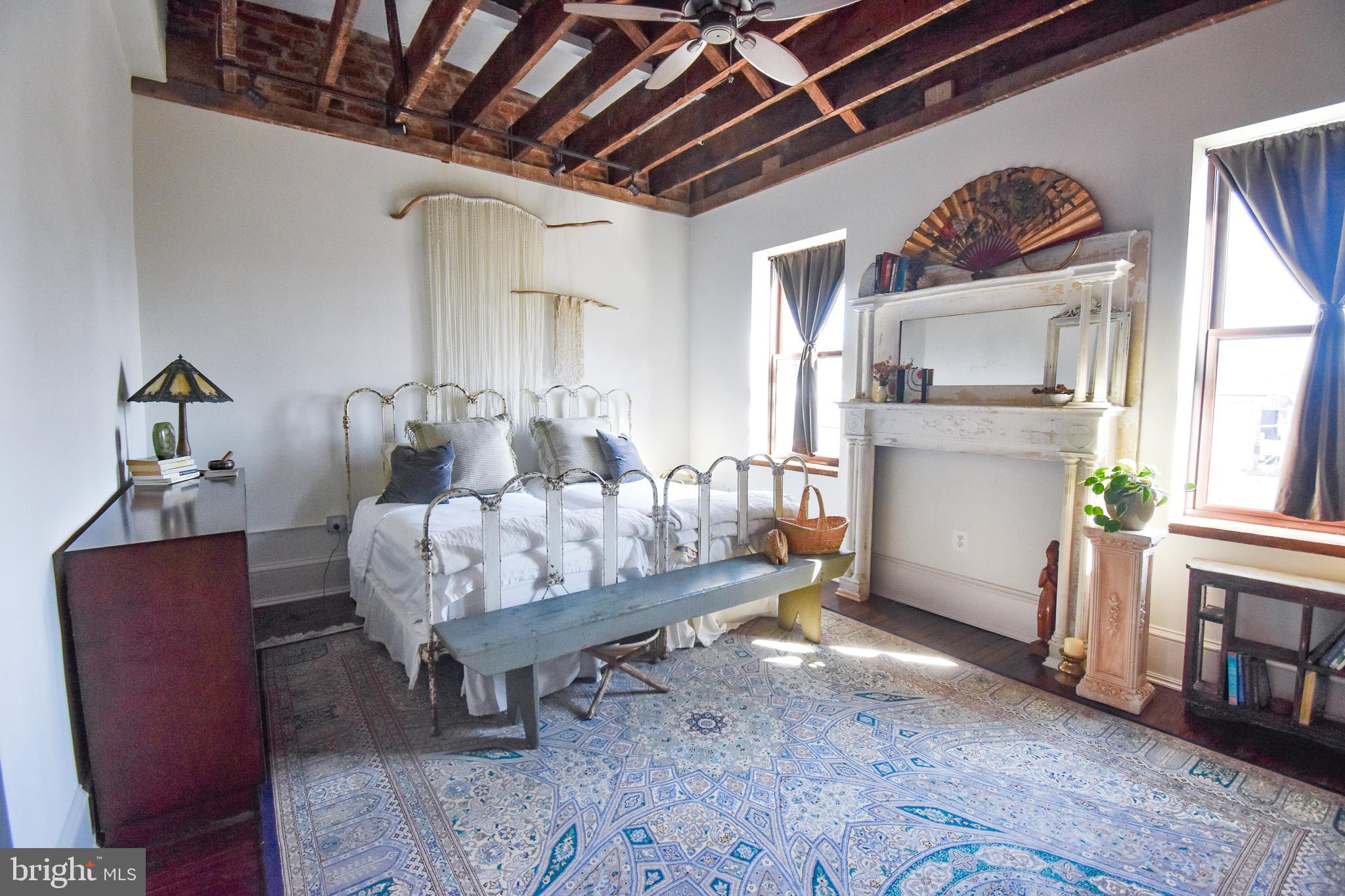 1830 Columbia Road Northwest Washington, DC 20009 - Photo 18 of 46 a living room with furniture and a wooden floor