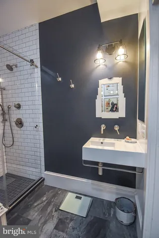 a bedroom with a bed chair and window