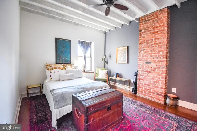 a bed room with a bed and a window