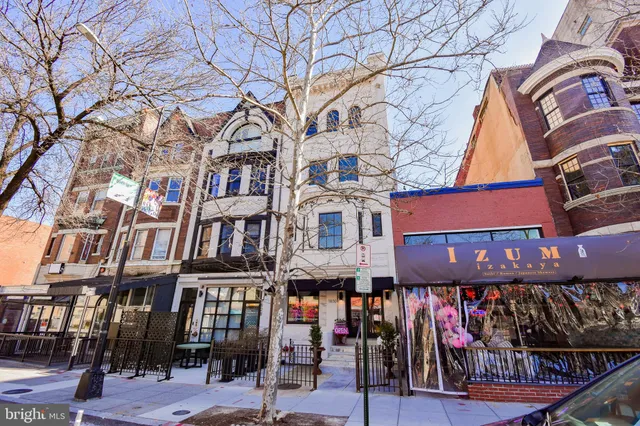 a living room with furniture a window and a fireplace