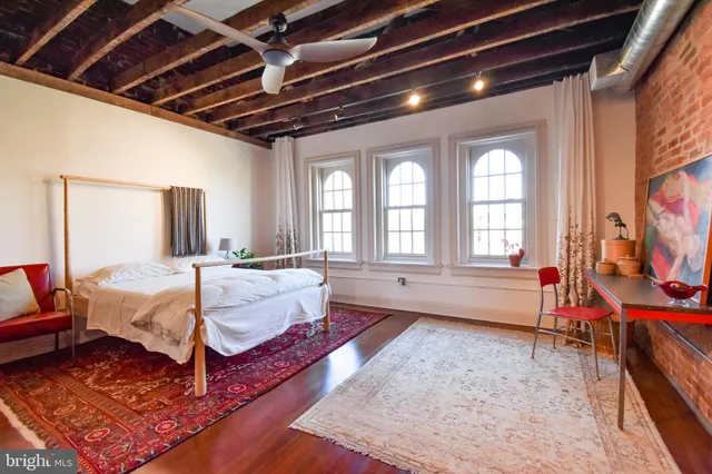 a view of an entryway with wooden floor