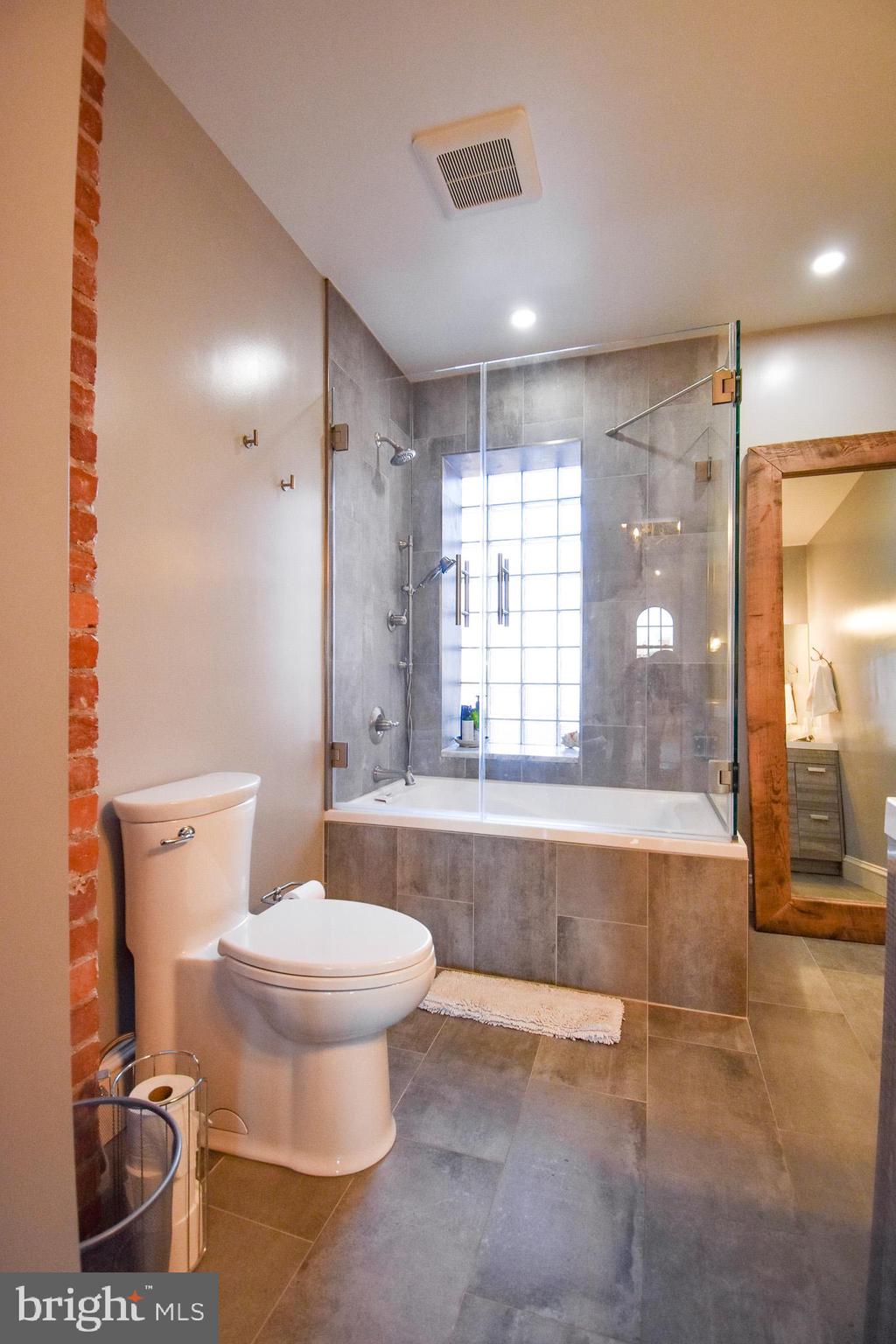 1830 Columbia Road Northwest Washington, DC 20009 - Photo 34 of 46 a bathroom with a toilet and a shower