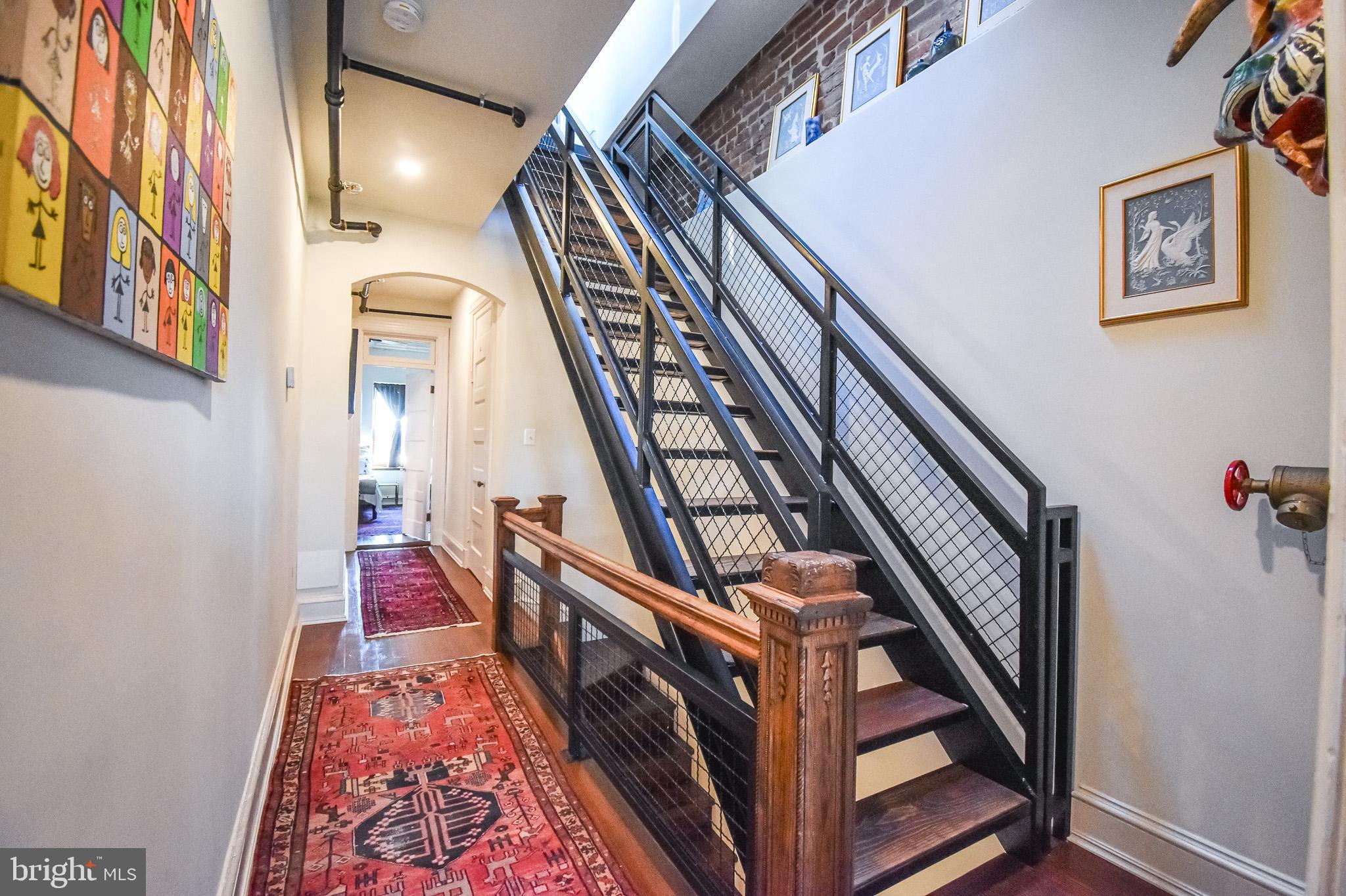 1830 Columbia Road Northwest Washington, DC 20009 - Photo 35 of 46 a view of an entryway with wooden floor