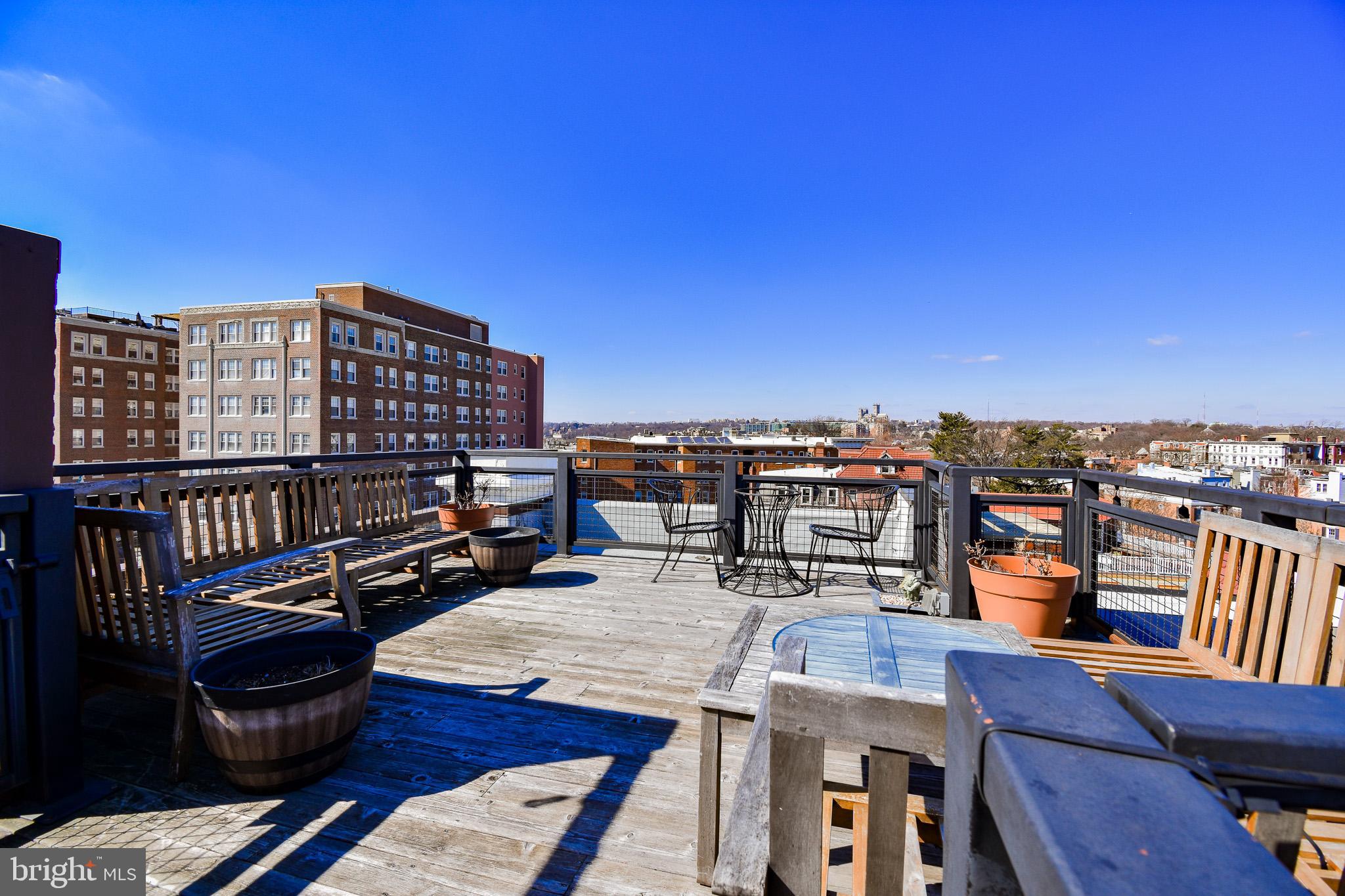1830 Columbia Road Northwest Washington, DC 20009 - Photo 36 of 46 a view of a balcony with a chairs