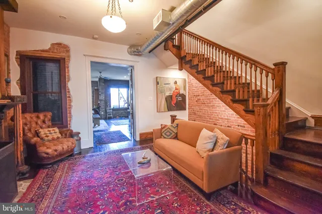 a bathroom with a toilet a sink and a mirror