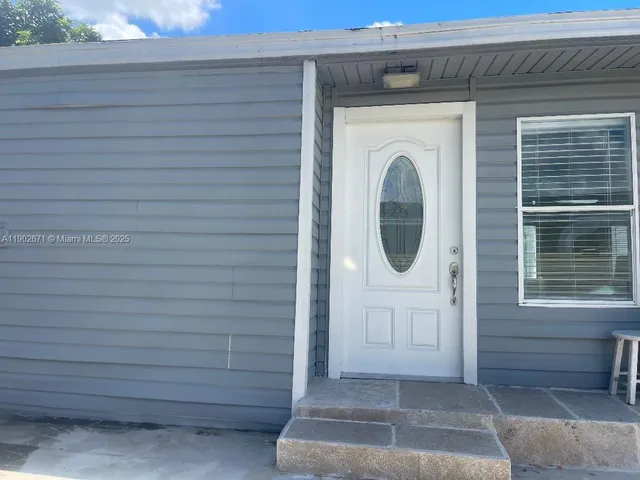 a view of a door of a house with a door