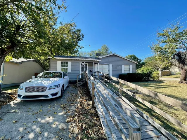 a car parked in front of a house